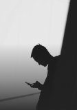 man scrolling on phone